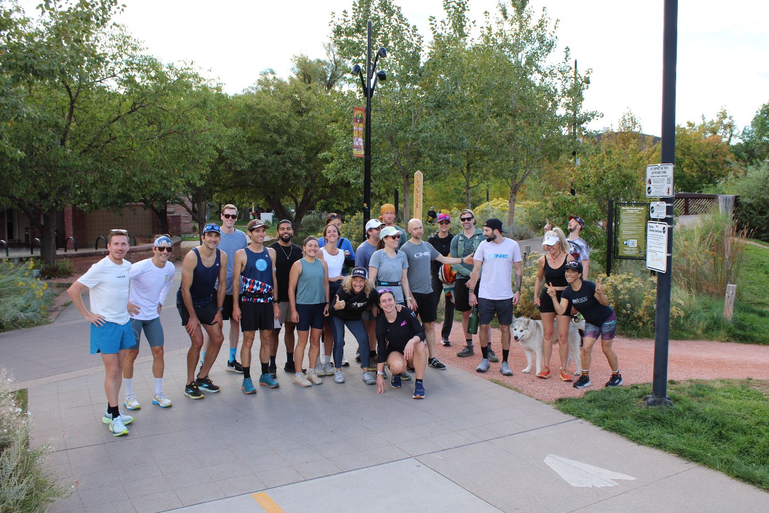 A big group of members and trainers on the Boulder Creek path