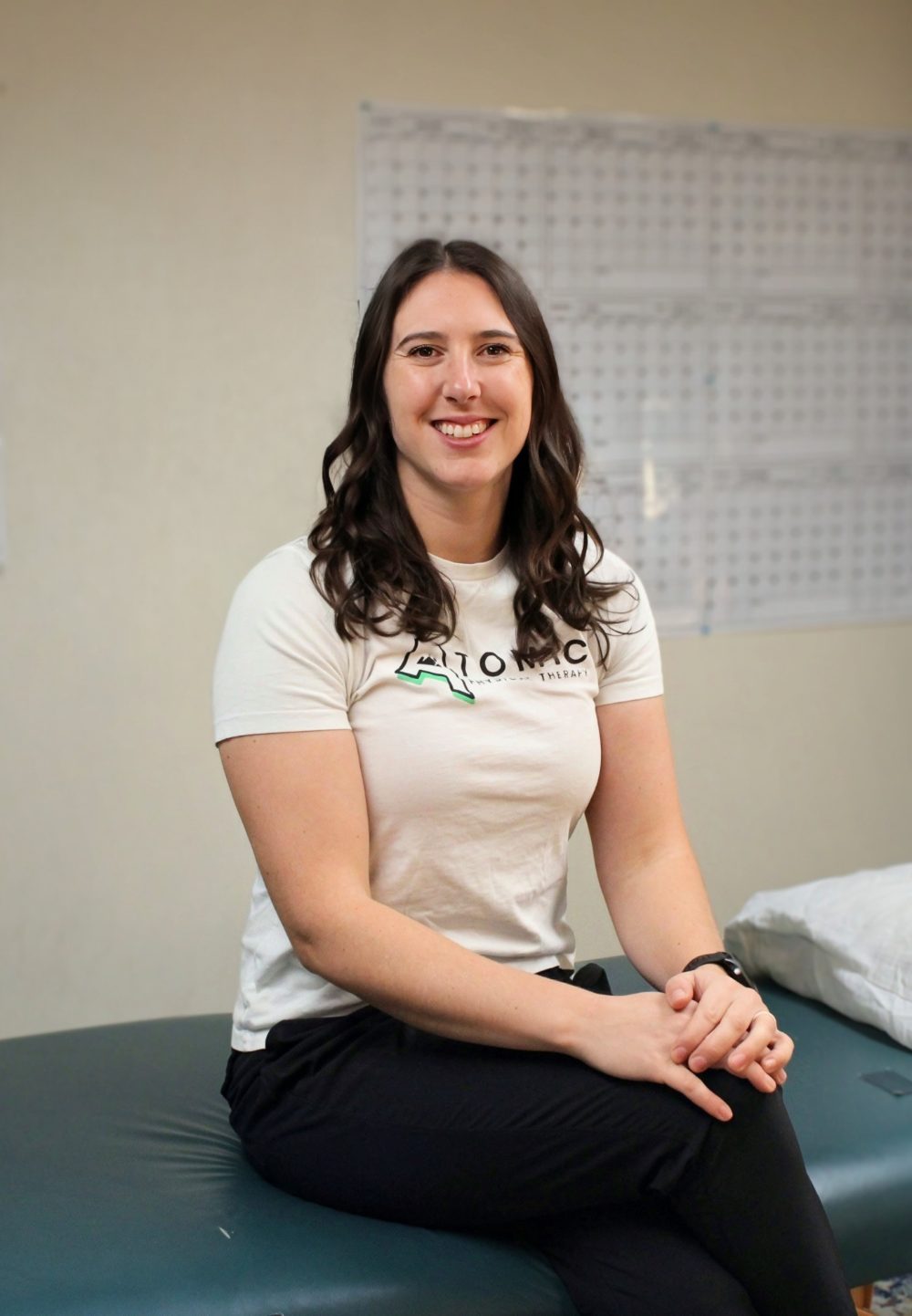 The resident physical therapist working with a member