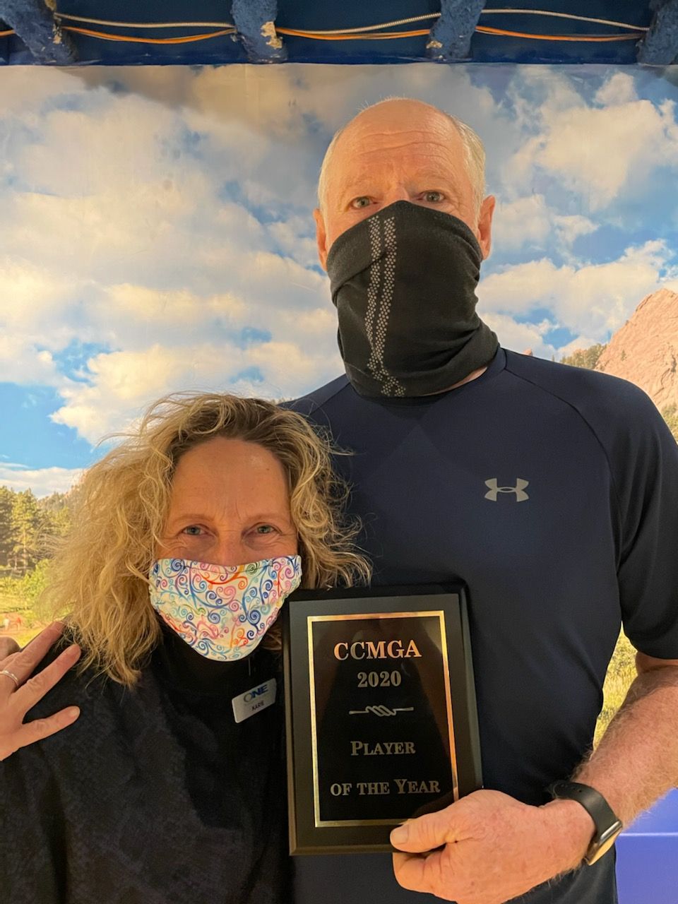 Karie with a member holding his player-of-the-year plaque