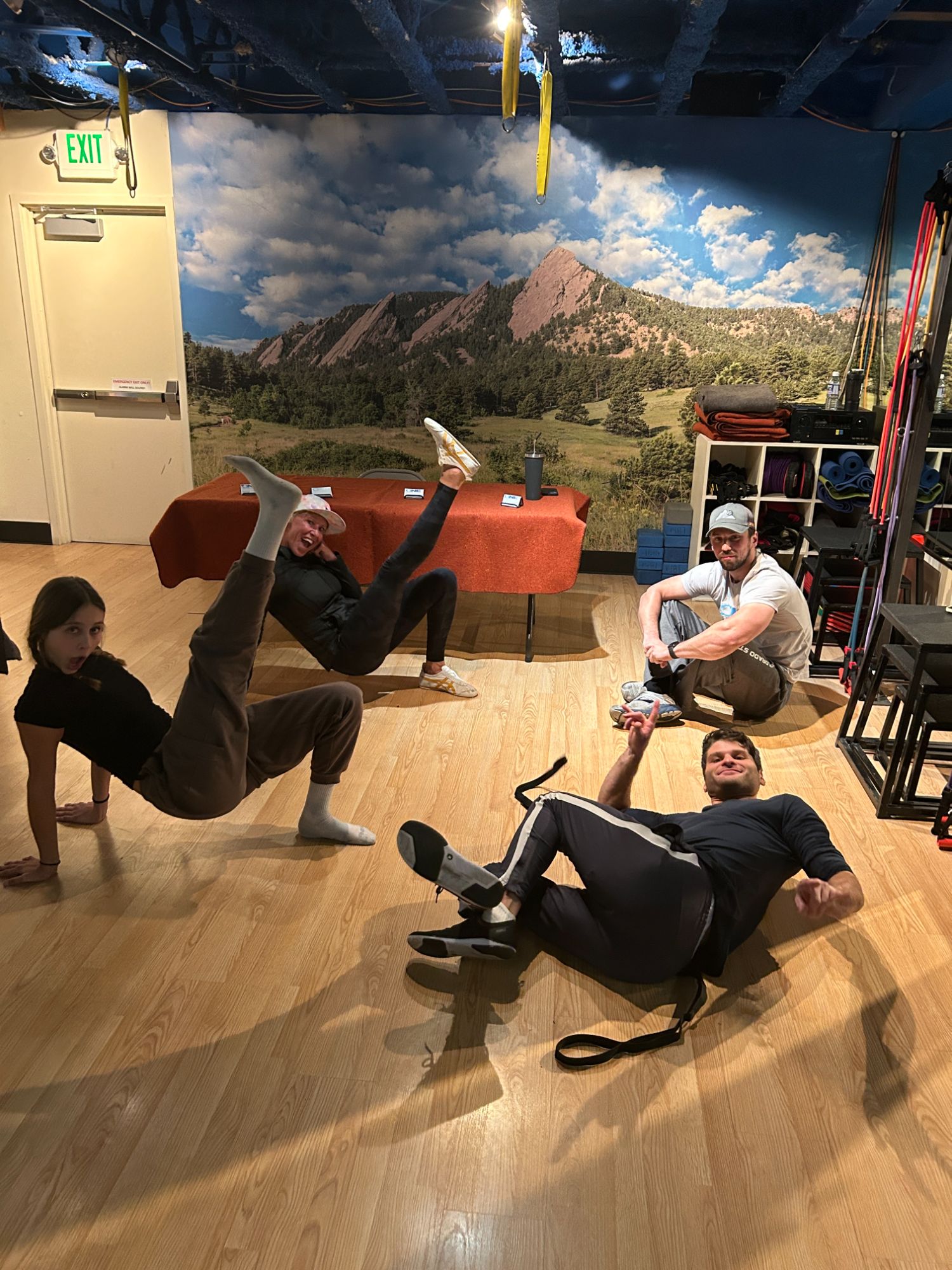 A group class working on the studio floor